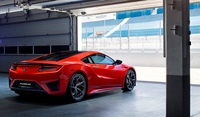 NSX driving out of garage
