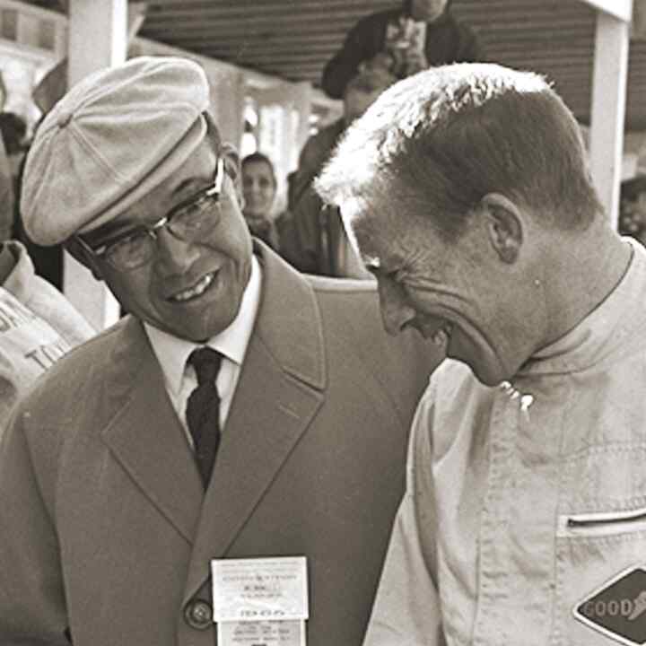 Soichiro Honda and Richie Ginther at a race track.