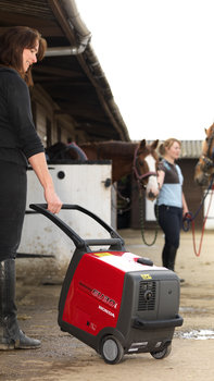 Portable being used by model, farm location.
