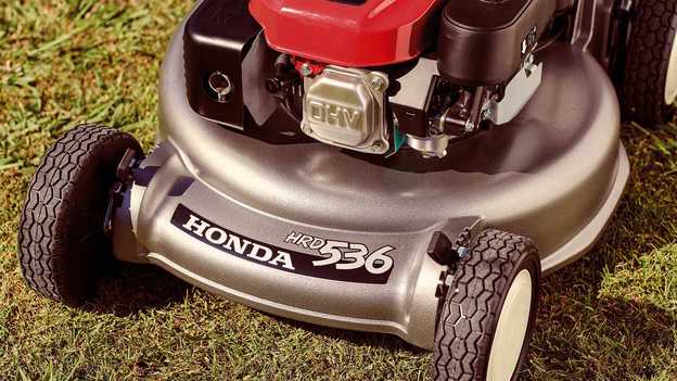 Honda HRD lawnmower close up of aluminium cutting deck in garden location.
