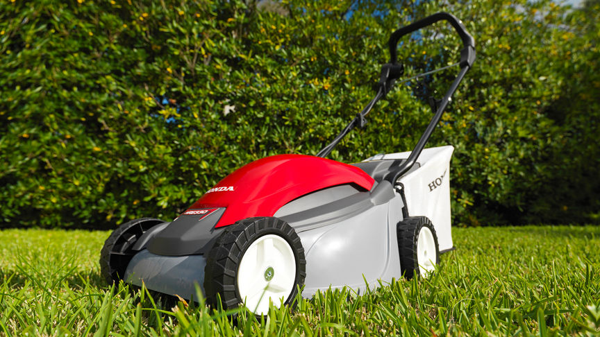 Honda HRE lawnmower, front three-quarter, left facing, garden location.