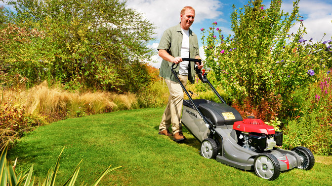 Honda HRX lawnmowers, front-threequarter, right facing, garden location.