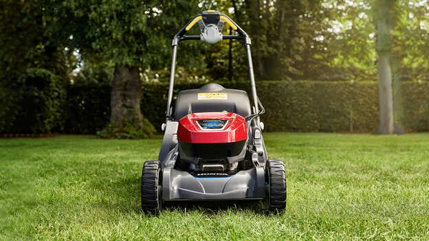 Front facing Honda HRX cordless on the lawn.