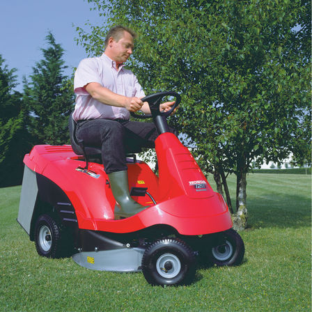 Ride-on, front three-quarter, right facing, being used by model, garden location.