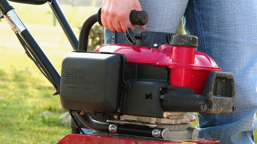 Honda microtillers, close up, focusing on handle.
