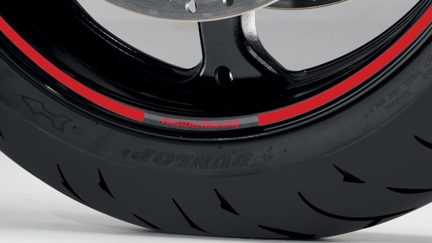 Close up of CBF125 wheel with Honda sticker.