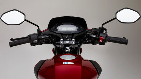 Honda CB125F red, studio shot, focus on LCD display