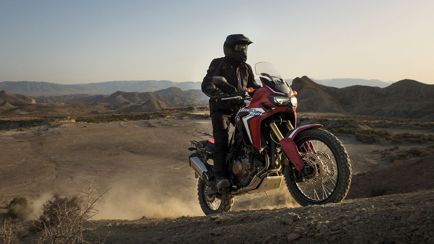 rider climbing up hill on Africa Twin