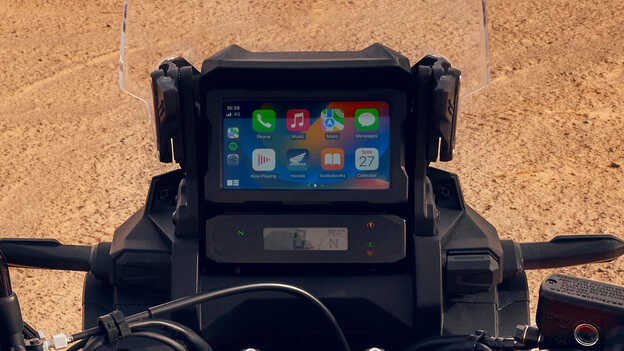 Close up of touch screen on a CRF1100L Africa Twin bike in a desert location.