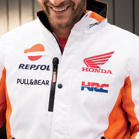 Man smiling wearing Honda race jumper.