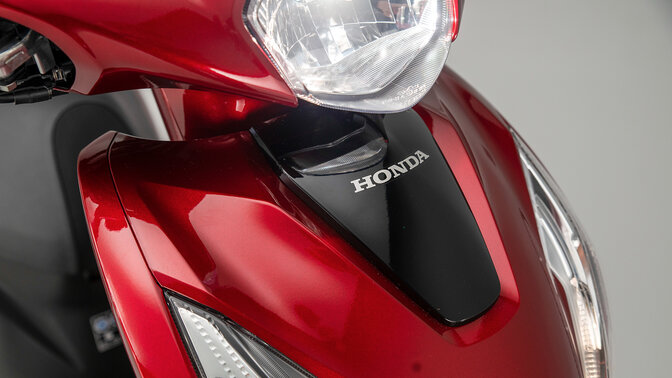 Honda Vision 110 close up of front fairing and headlight