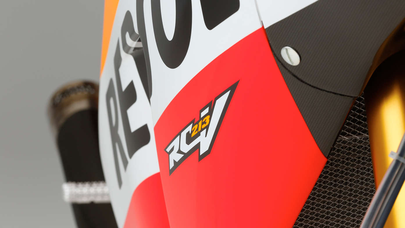 Close up of Honda motorcycle showing titanium and carbon fibre materials.