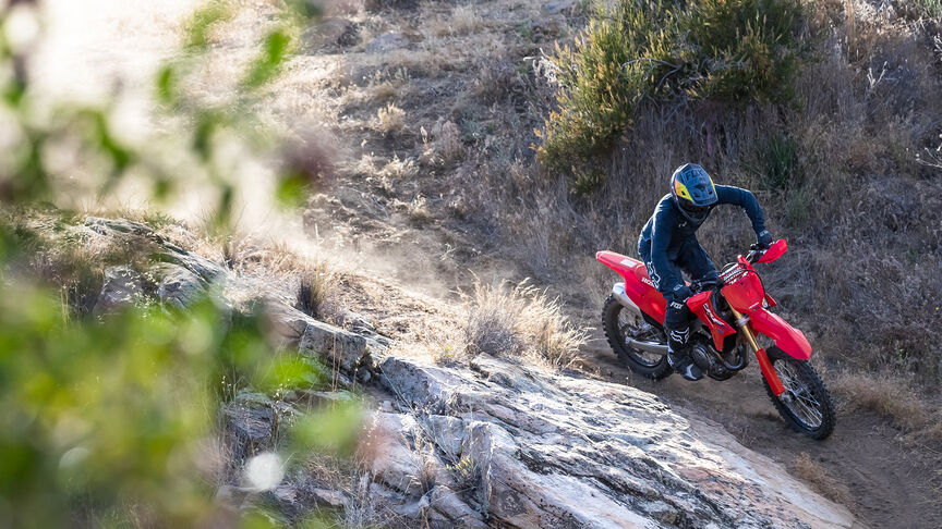 Honda CRF450RX on an off road trail.