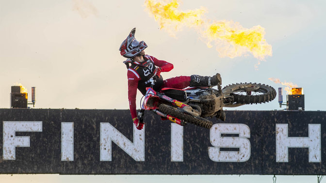 Honda MXGP rider in the air at the finish line.