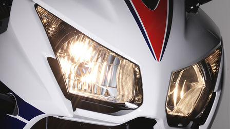 Close up of Honda motorcycle headlights.