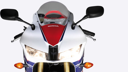 Front-on view of headlights, handlebars, windscreen.