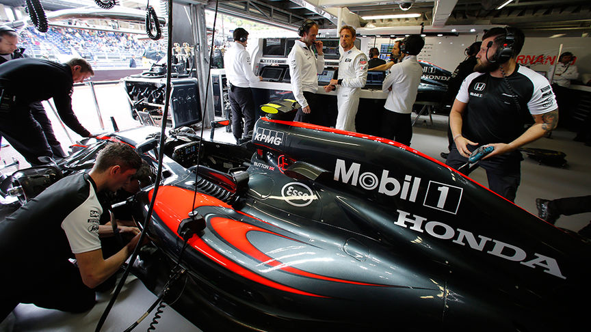 team working on F1 car
