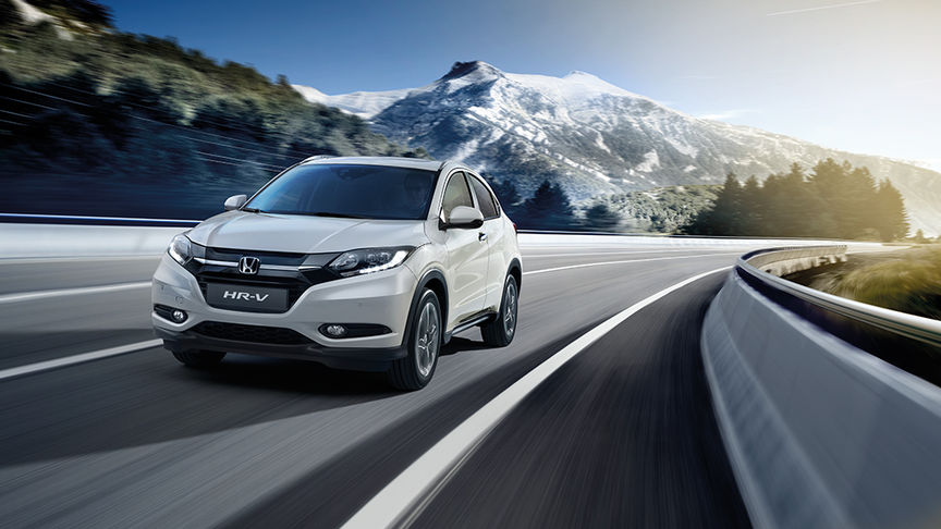 HR-V on scenic road with mountains in the background