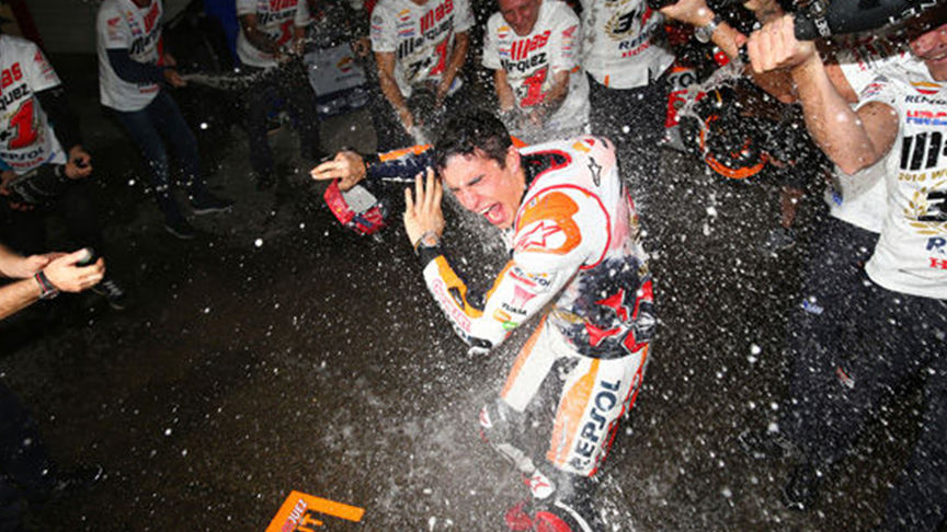 rider being sprayed with champagne