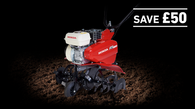 Compact Tiller in soil on a dark background with Save £50