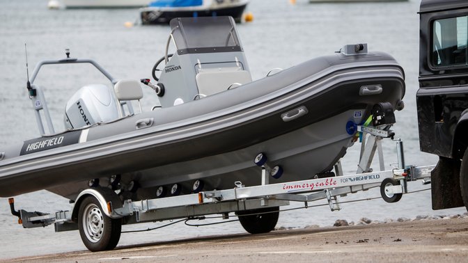 side angled view of highfield boat fitted with honda 40-50 on engine trolley