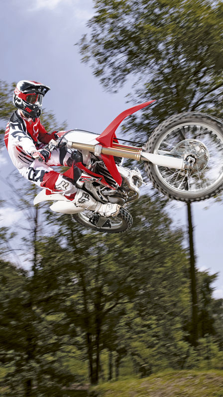 Red CRF250R motorbike front-on view.