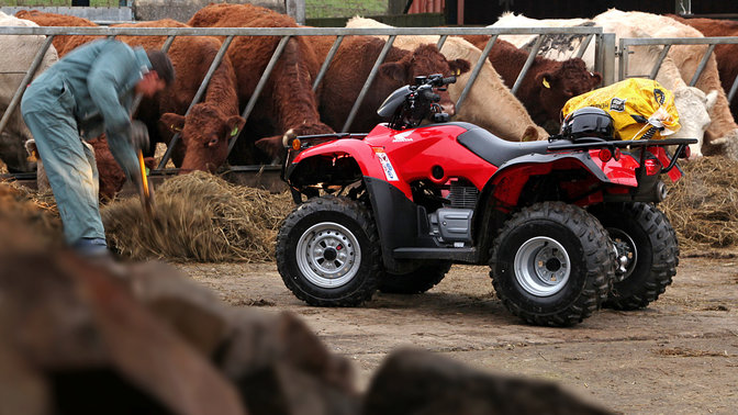 Side view of Fourtrax 250, farm location.