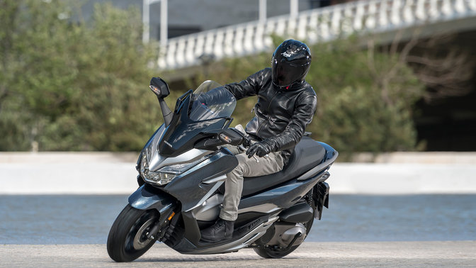 A man riding a Honda Motorcycle