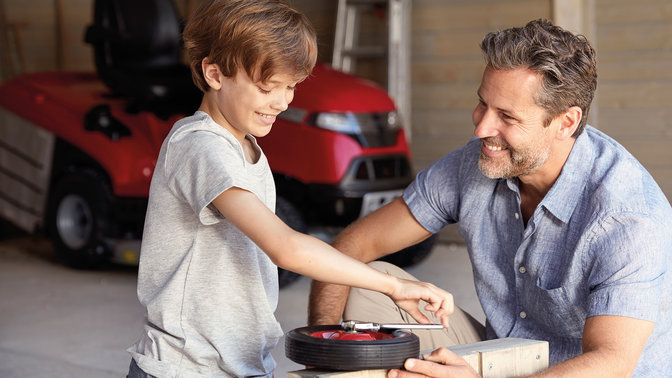 Father and son in a garage