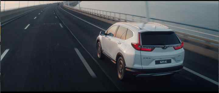 Rear three-quarter facing Honda CR-V.