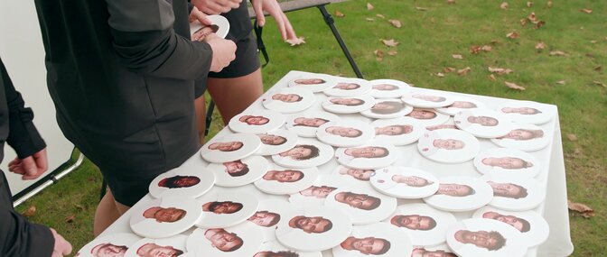 Red Roses build their dream team by selecting faces on a table.