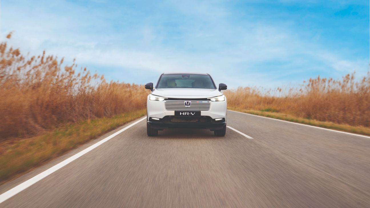 white Honda HR-V on the road