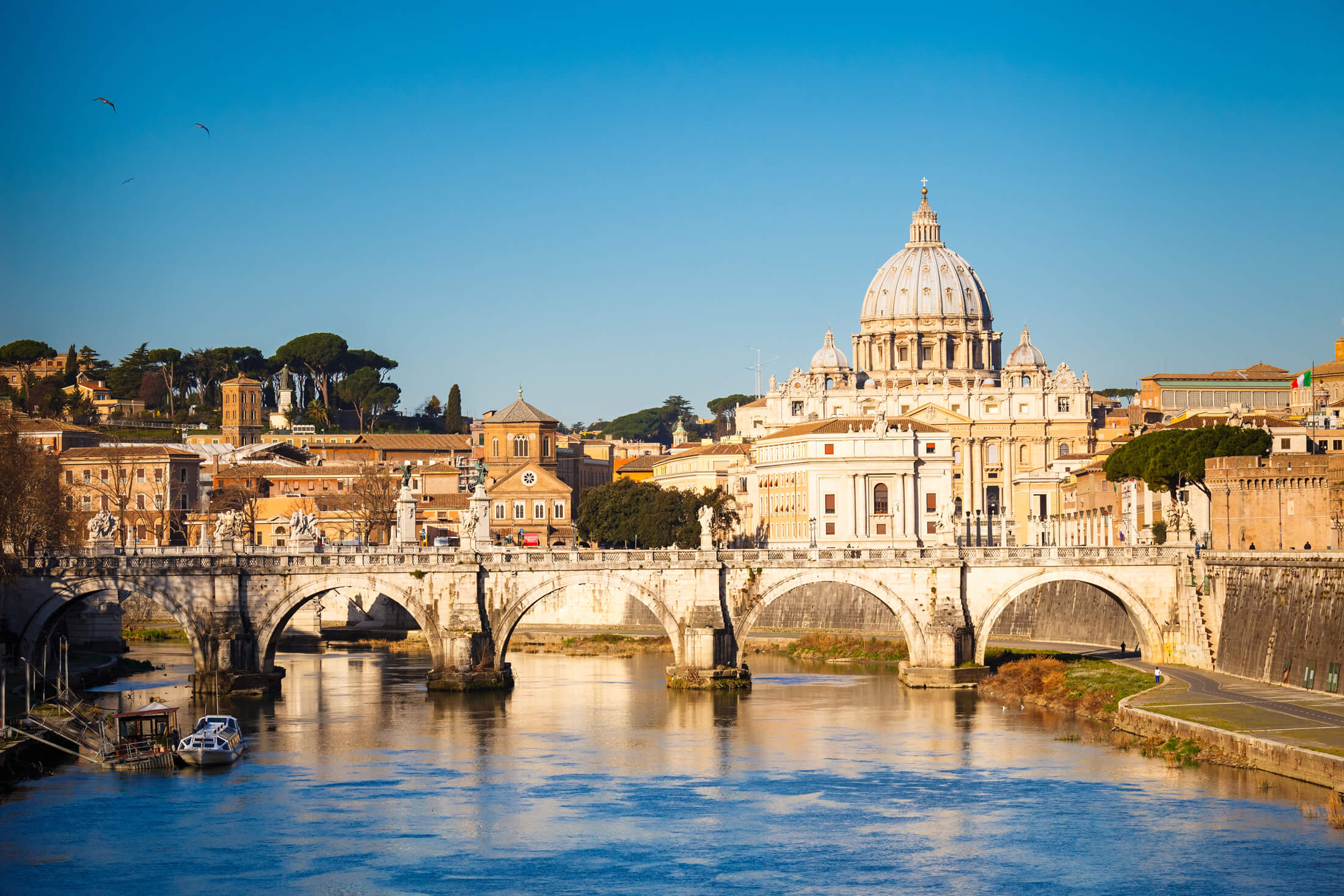 Looking up the River Tiber to St Peter's Basilica in Rome, Italy