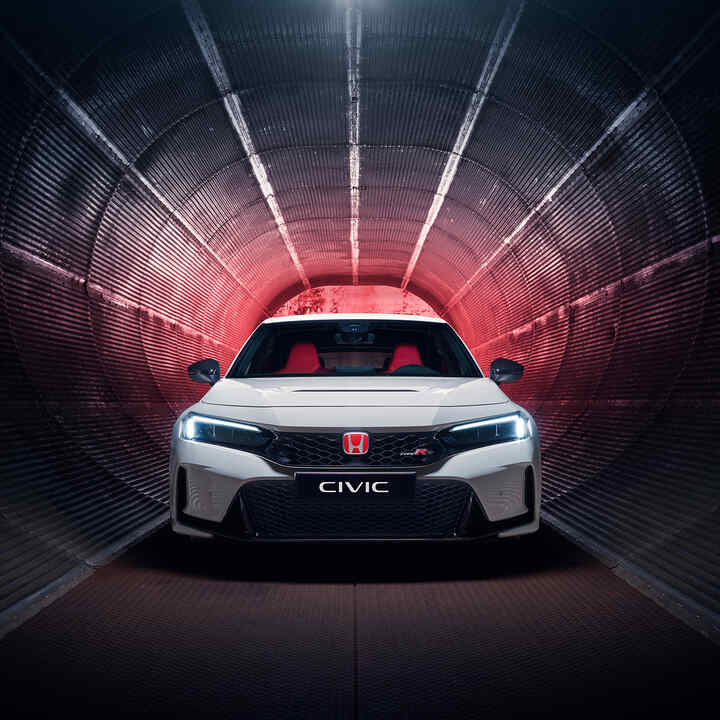 Front facing Honda Civic Type R parked in a tunnel. 