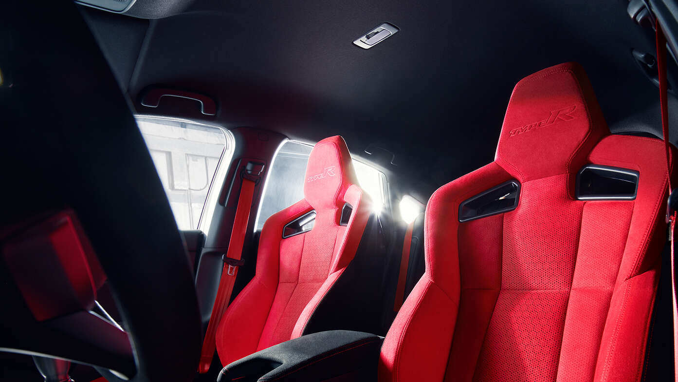 Close up of the Honda Civic Type R red suede upholstery.
