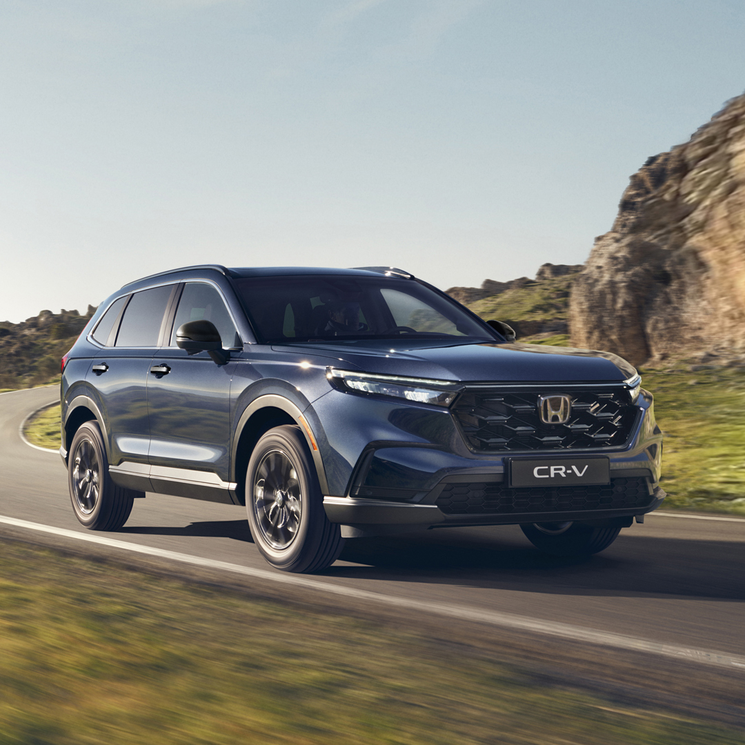 Blue CR-V on a mountain road