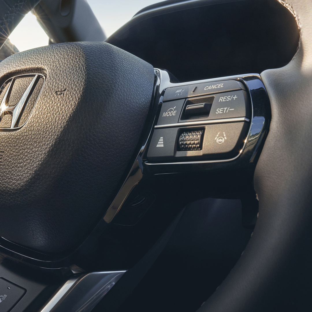Close up of Honda CR-V Hybrid heated leather steering wheel.