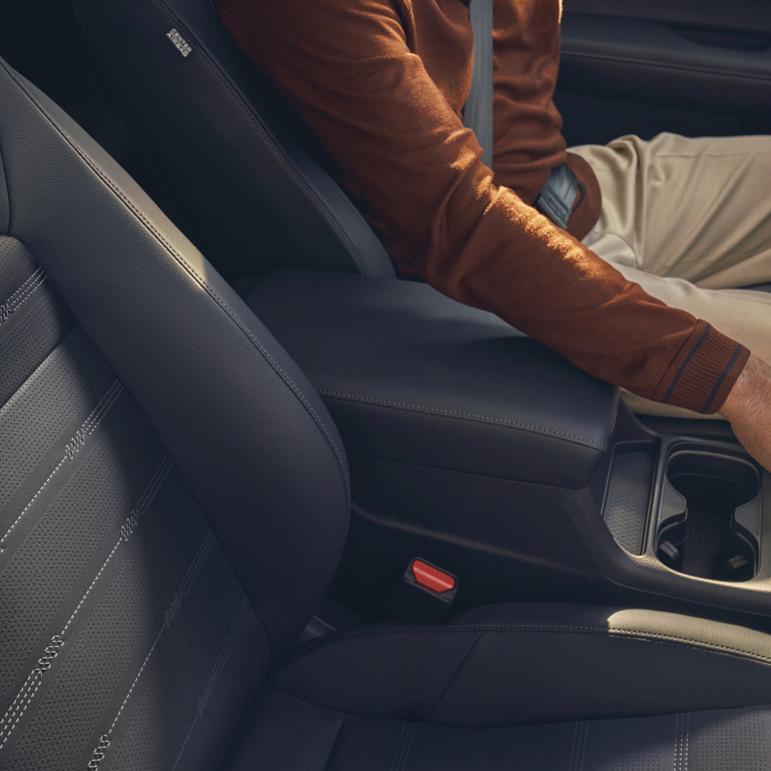 Close up of heated front seats and heated seats controls.