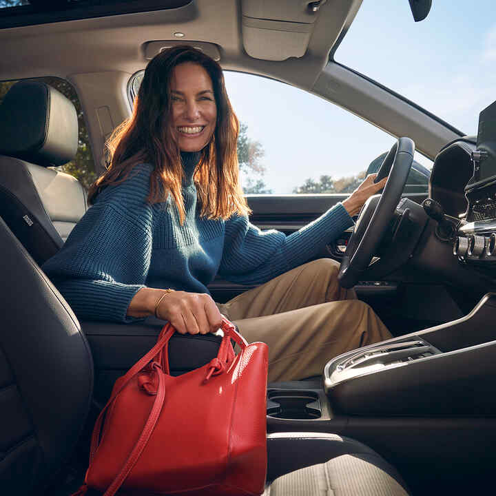 Close up of interior in Honda CR-V Hybrid to show storage in armrest.