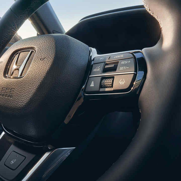 Close up of Honda CR-V Hybrid heated leather steering wheel.