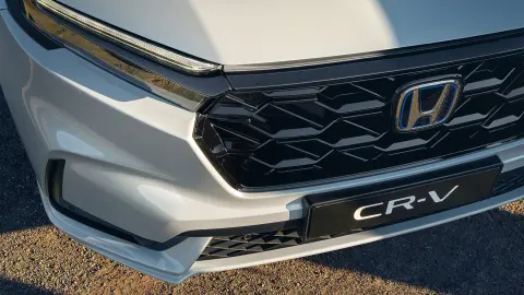 CR-V Hybrid SUV close up of front mesh grille.