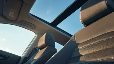 CR-V Hybrid SUV interior shot featuring panoramic glass roof.