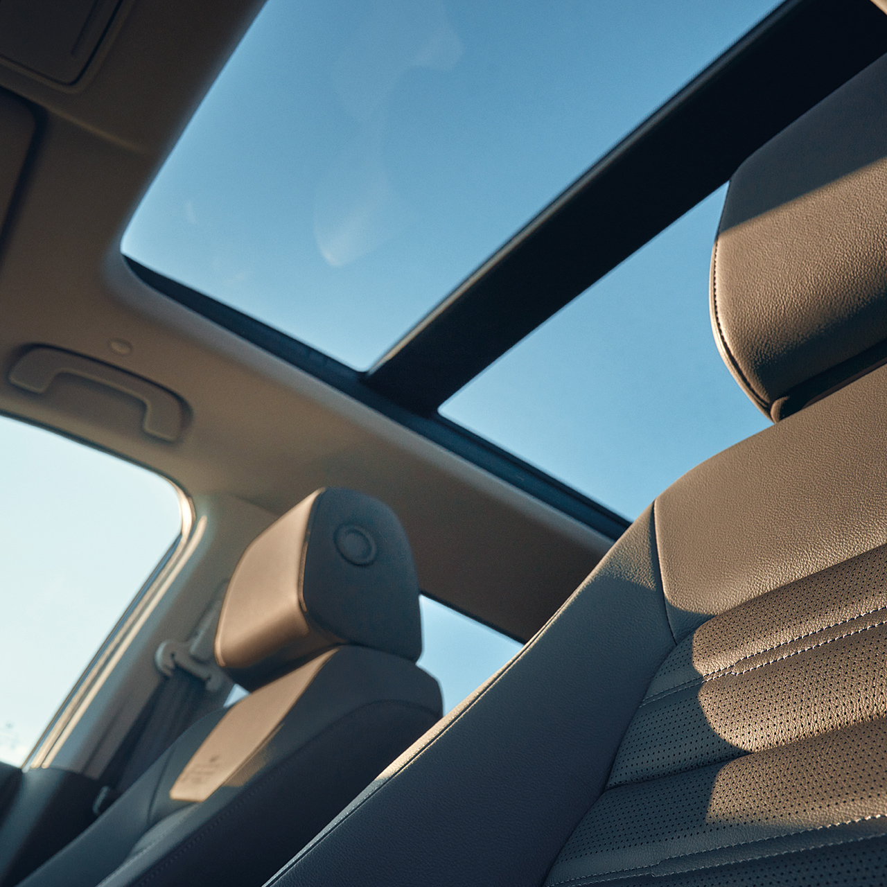 CR-V Hybrid SUV interior shot featuring panoramic glass roof.
