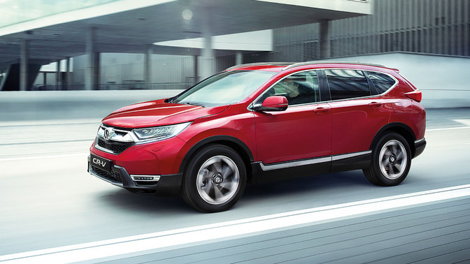 Front three-quarter facing Honda CR-V, city location.