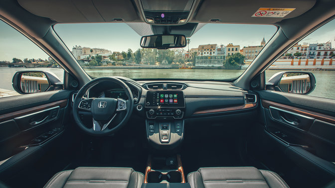 Interior dashboard close up of Honda CR-V Hybrid facing street location.