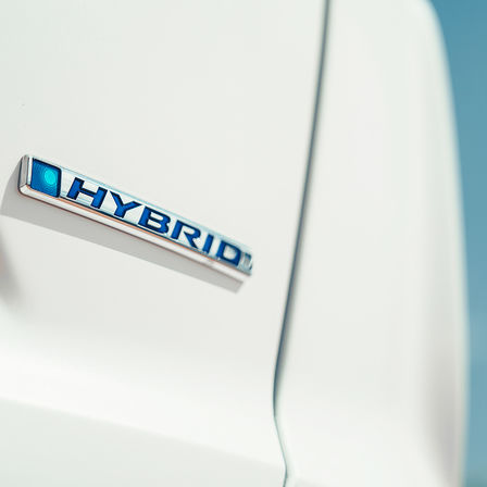 Close up shot of Honda CR-V Hybrid logo.