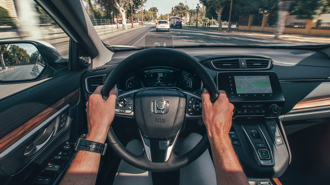 Close up of Honda CR-V Hybrid interior view facing street location.