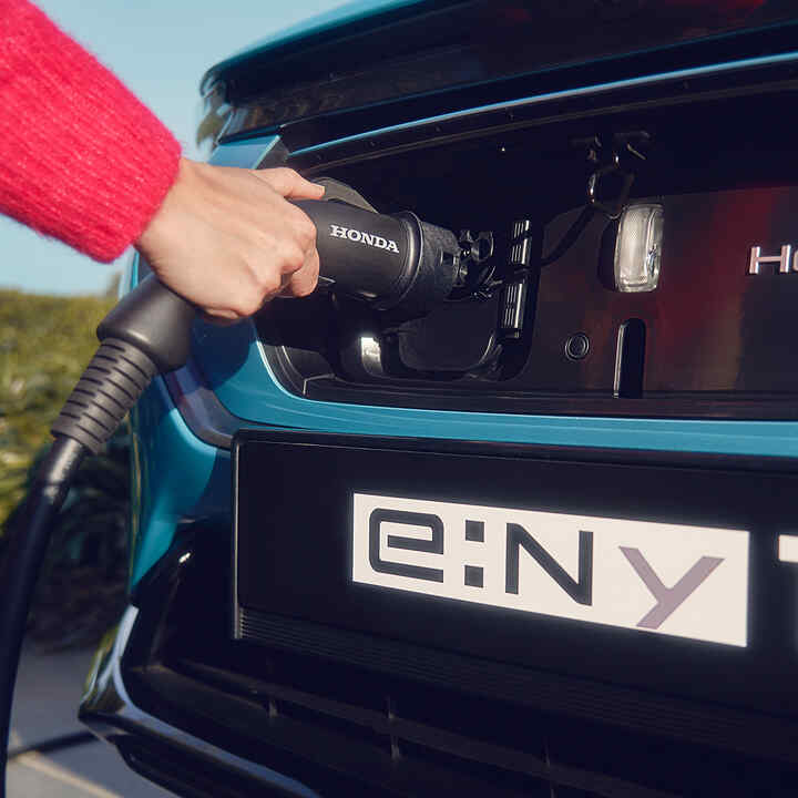 Close up of the Honda e:Ny1 hidden charging port. 