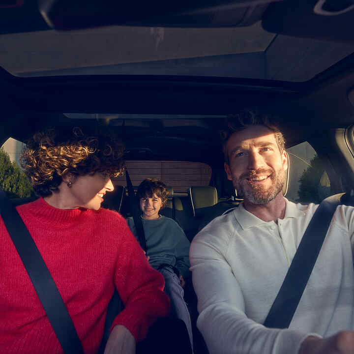 Family sitting inside Honda e:Ny1.