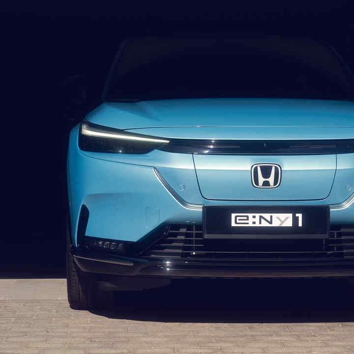 Close up of parked front facing Honda e:Ny1.